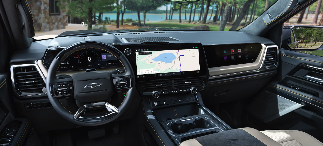 2027 Chevrolet Silverado 1500 ZR2 on off-road terrain showing 2-inch factory lift and mud-terrain tires