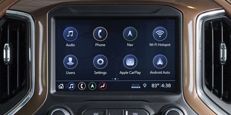 Used Chevy Silverado 1500 interior showing touchscreen infotainment and spacious cabin