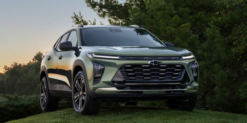2026 Chevrolet Trax driving on a suburban road